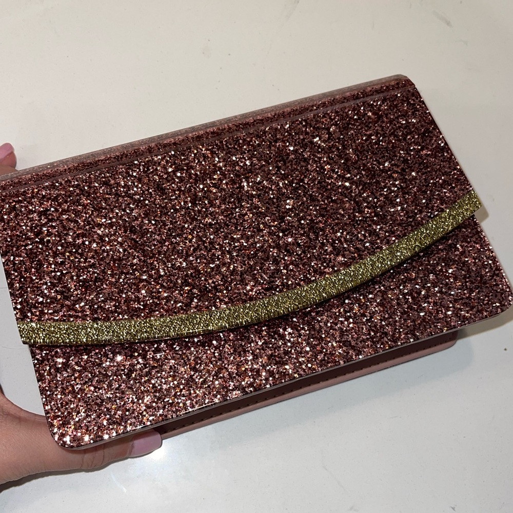 Pink/rose sparkling clutch and/or crossbody with chain strap.